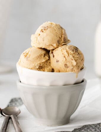Butter pecan ice cream in a white dish