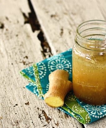 a jar of ginger dressing with fresh ginger