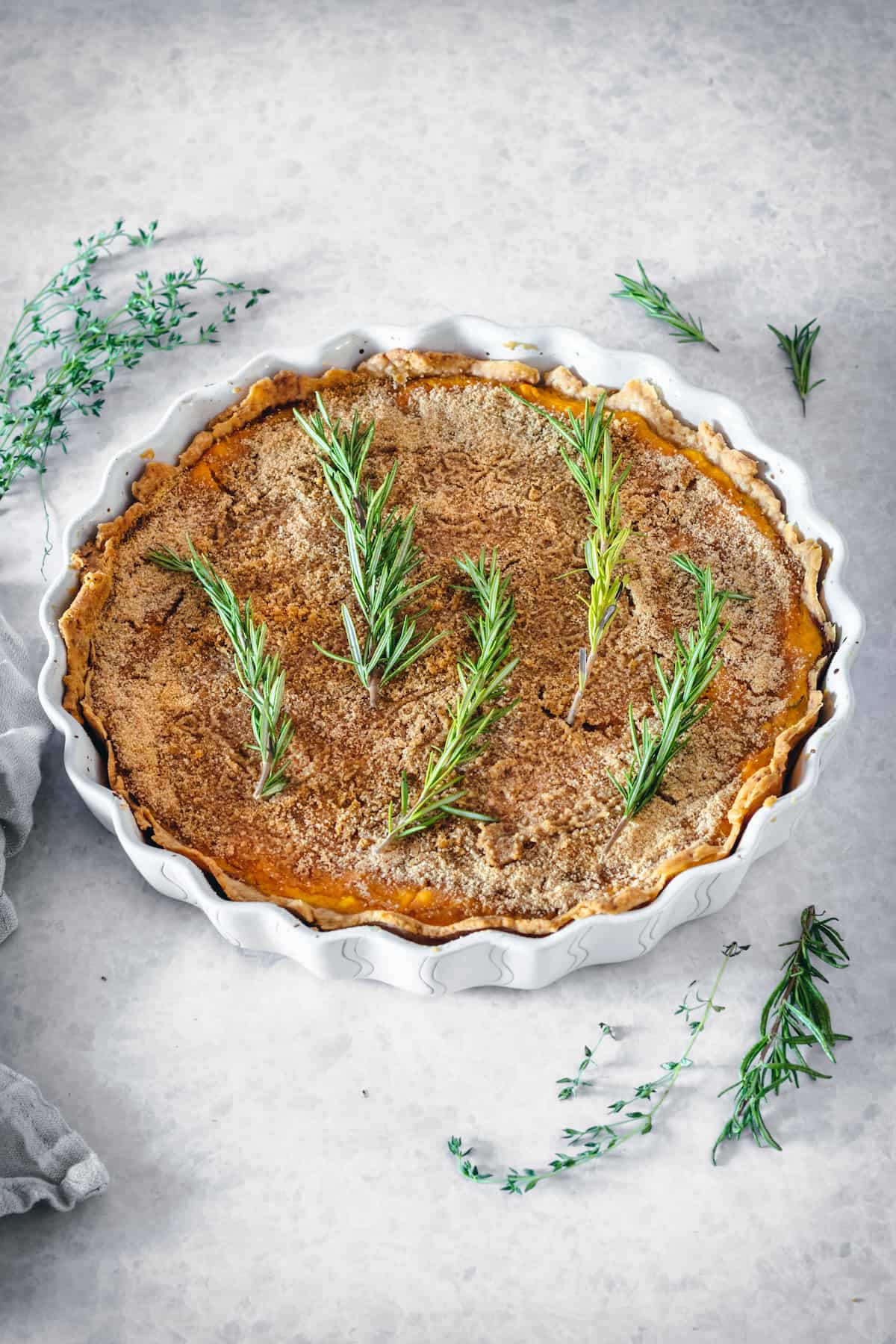 Butternut squash tart with caramelized onions topped with rosemary