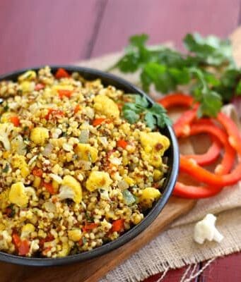 a bowl of curried cauliflower and couscous salad