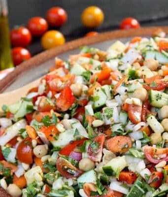 a large pottery bowl of Mediterranean Chopped Salad