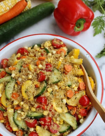 A bowl of end of summer quinoa salad with curry vinaigrette