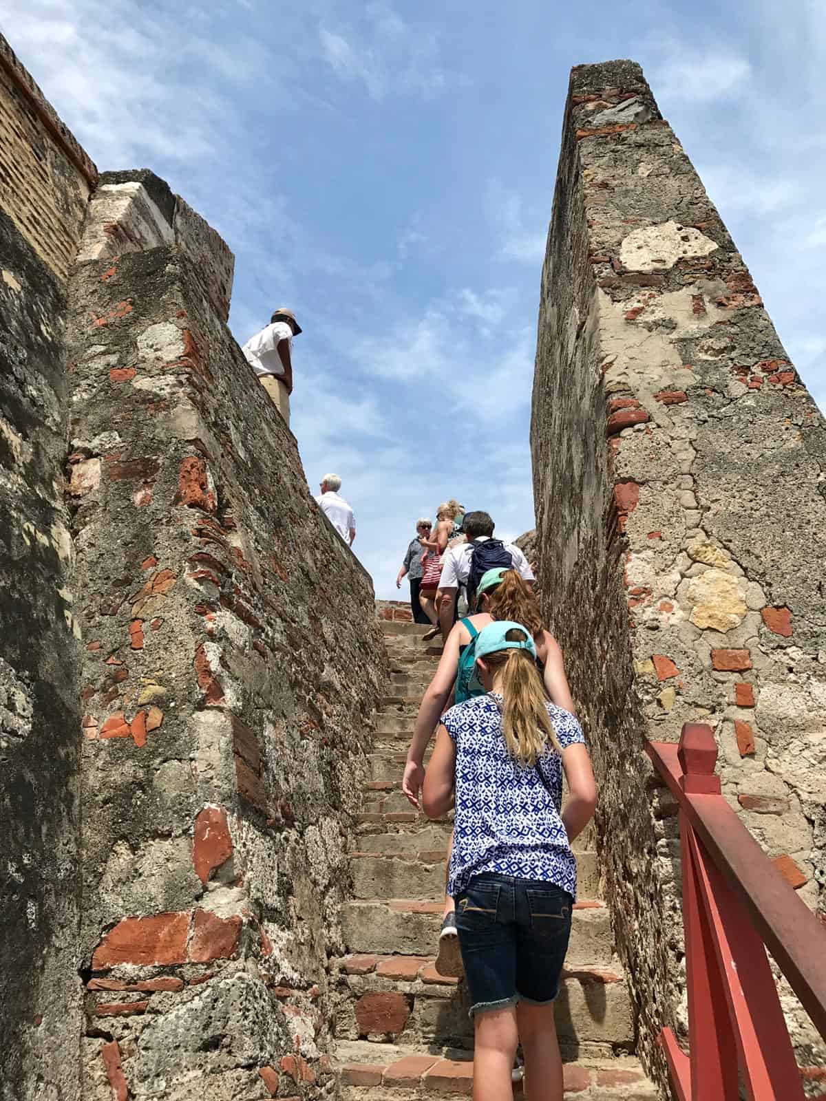 climbing the steps of Castillo de San Felipe de Barajas in Cartagena, Colombia