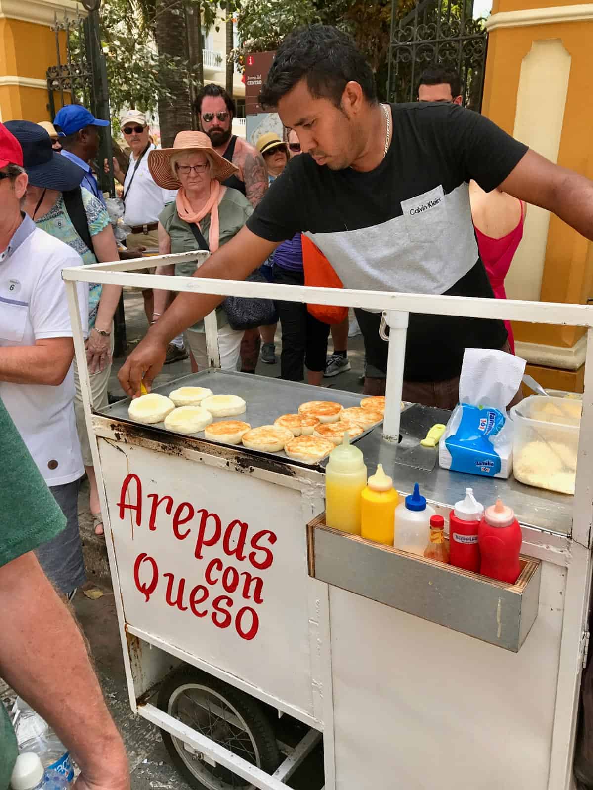 a man selling arepas con queso in Cartagena, Colombia