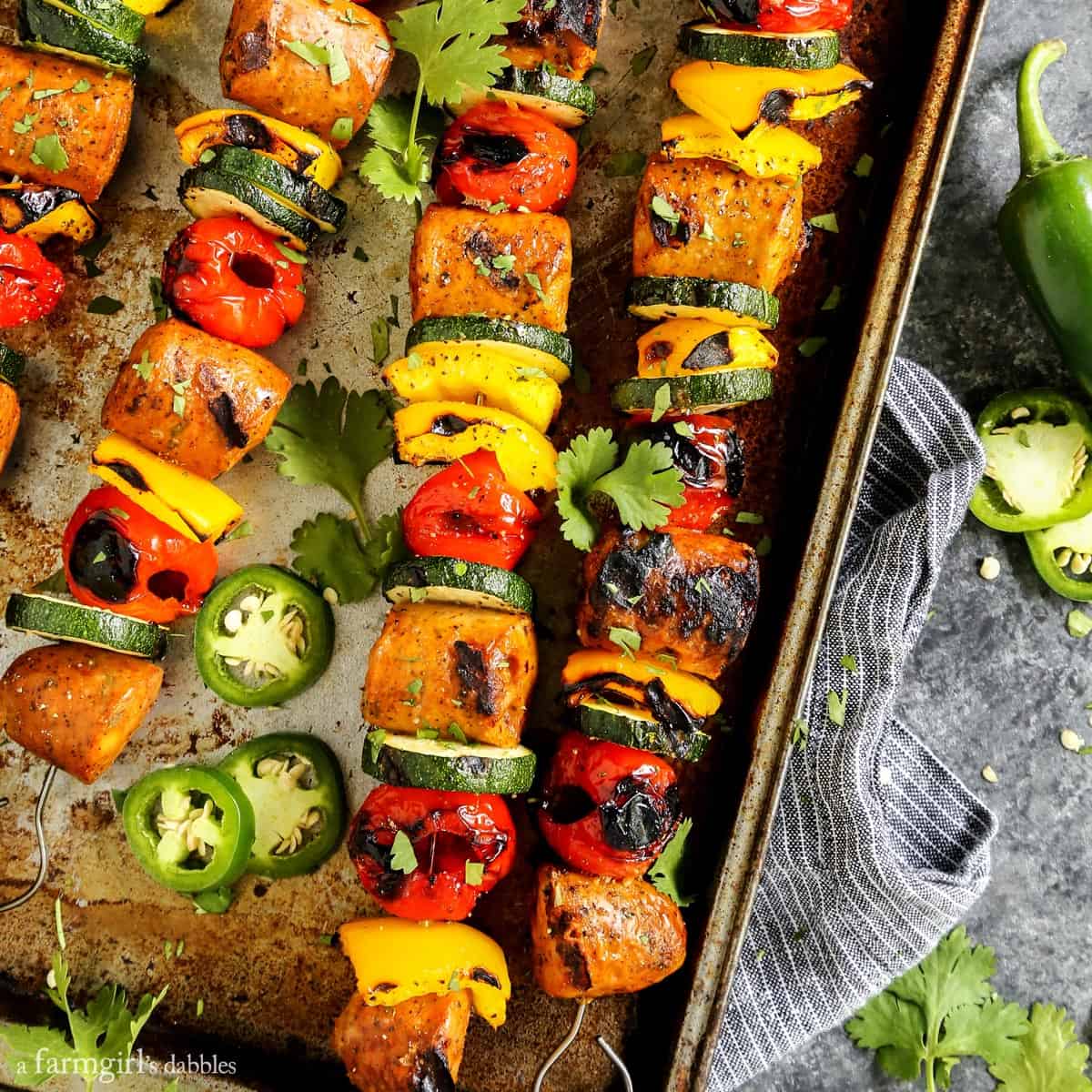 https://www.afarmgirlsdabbles.com/wp-content/uploads/2017/07/grilled-jalapeno-cheddar-chicken-sausage-kebabs-with-peppadews_AFarmgirlsDabbles_AFD-2_square.jpg