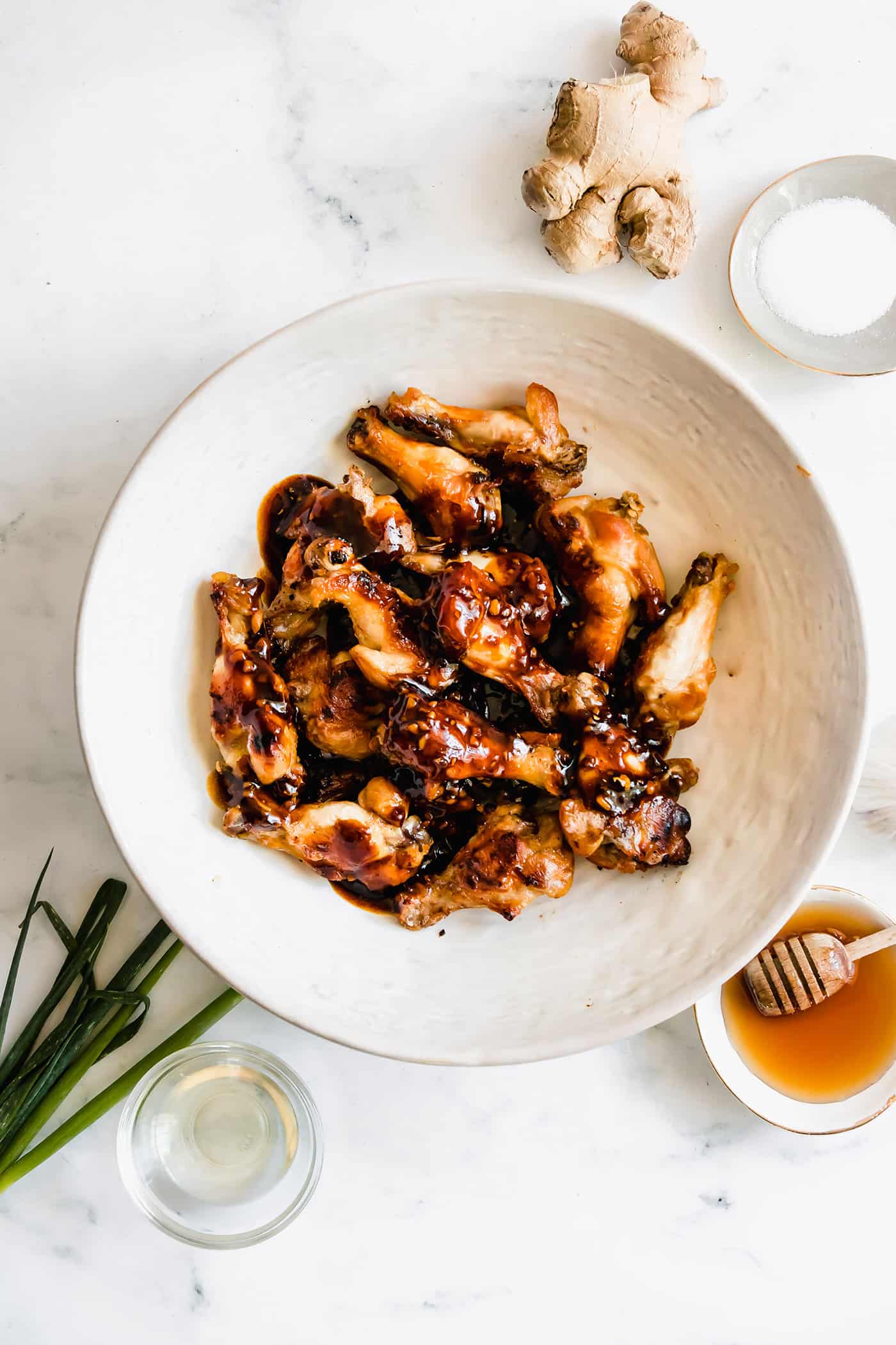 crispy oven baked chicken wings with oyster sauce poured over them