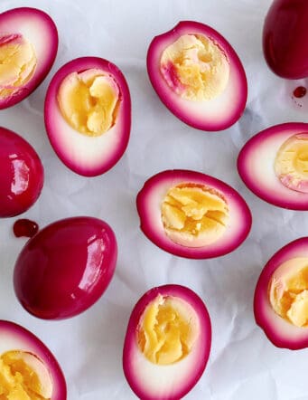 Overhead view of beet pickled eggs cut in half