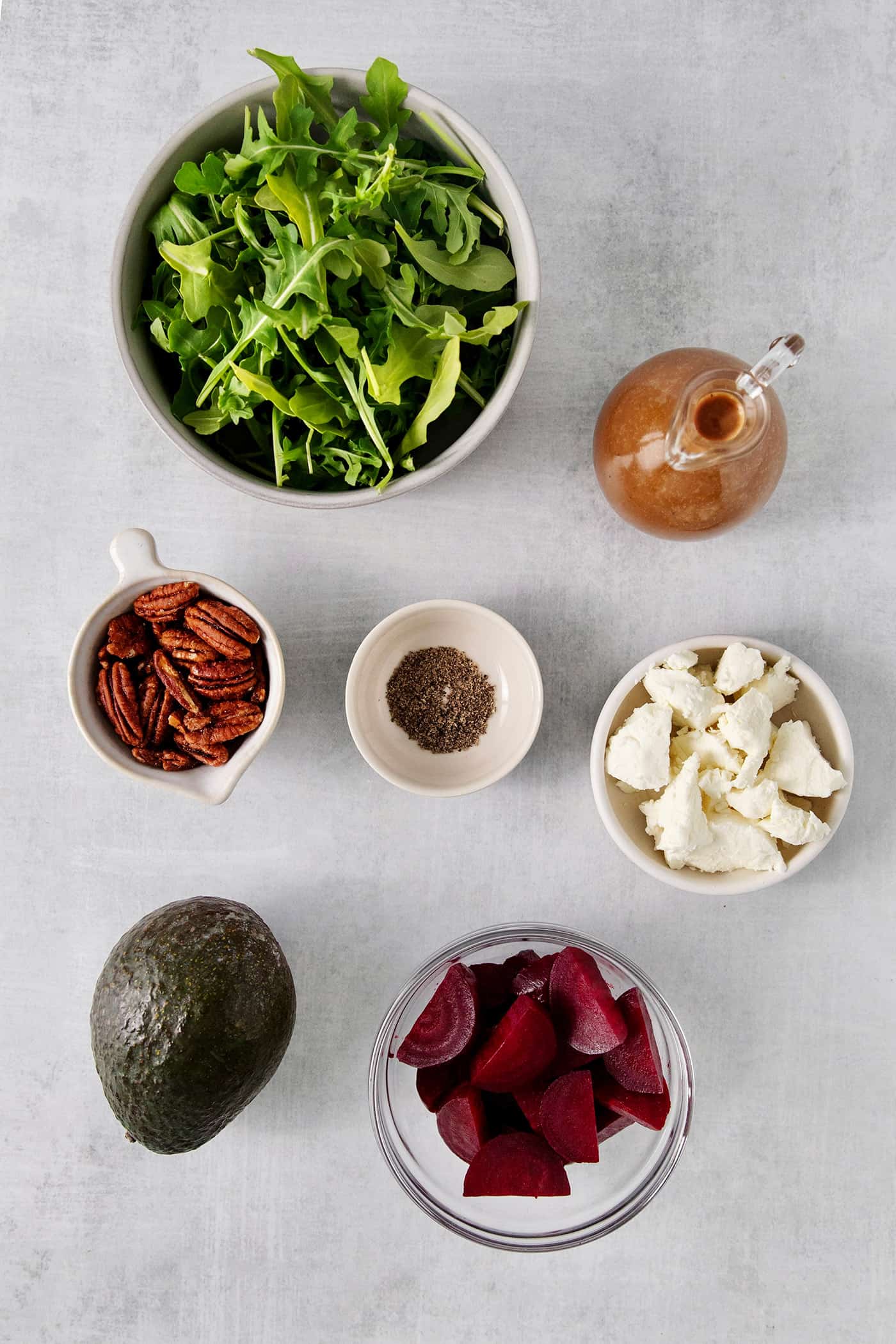 Overhead view of arugula salad ingredients
