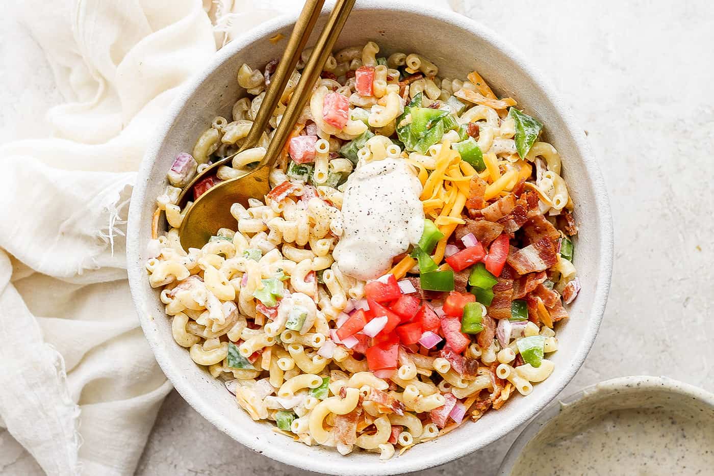 pasta salad with ranch dressing and bacon in a serving bowl