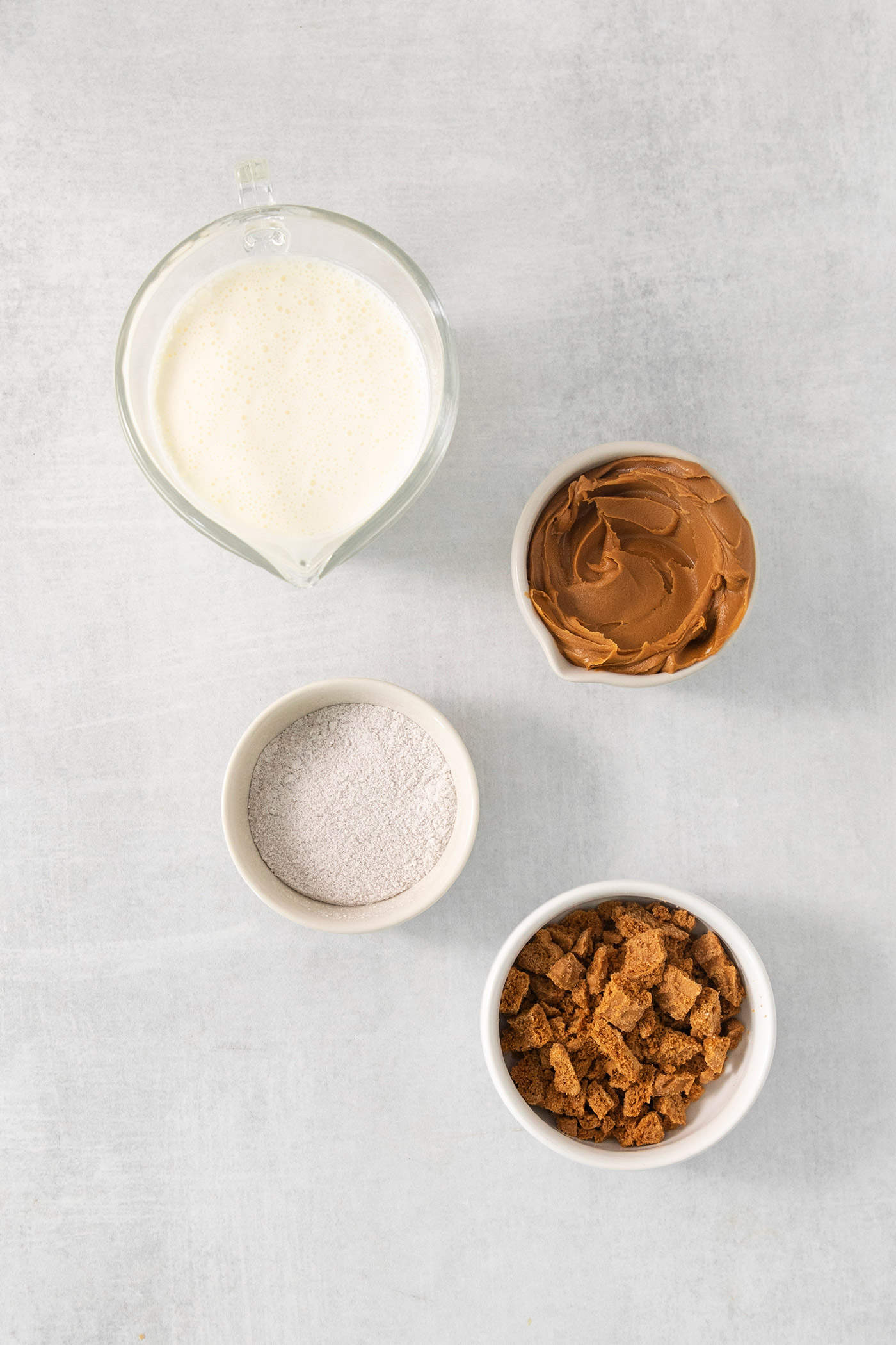 Ingredients for butterscotch whipped cream are shown on a white background: heavy cream, sugar, butterscotch pudding, and cookies.