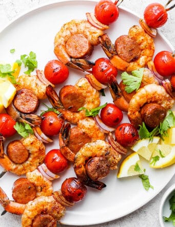grilled kabobs with shrimp and sausage, on a white plate