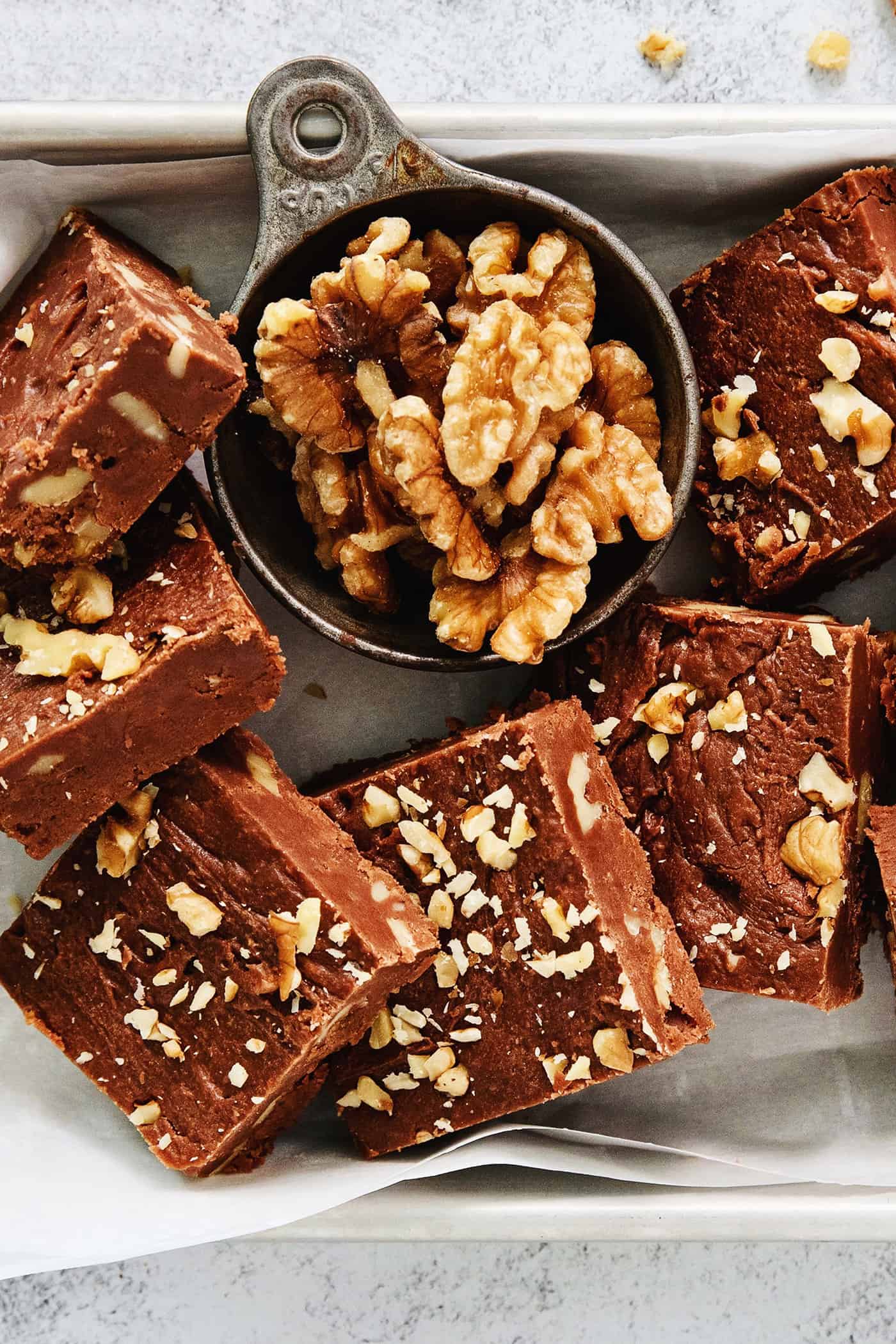 A tray of Fantasy Fudge is shown with walnuts above it.