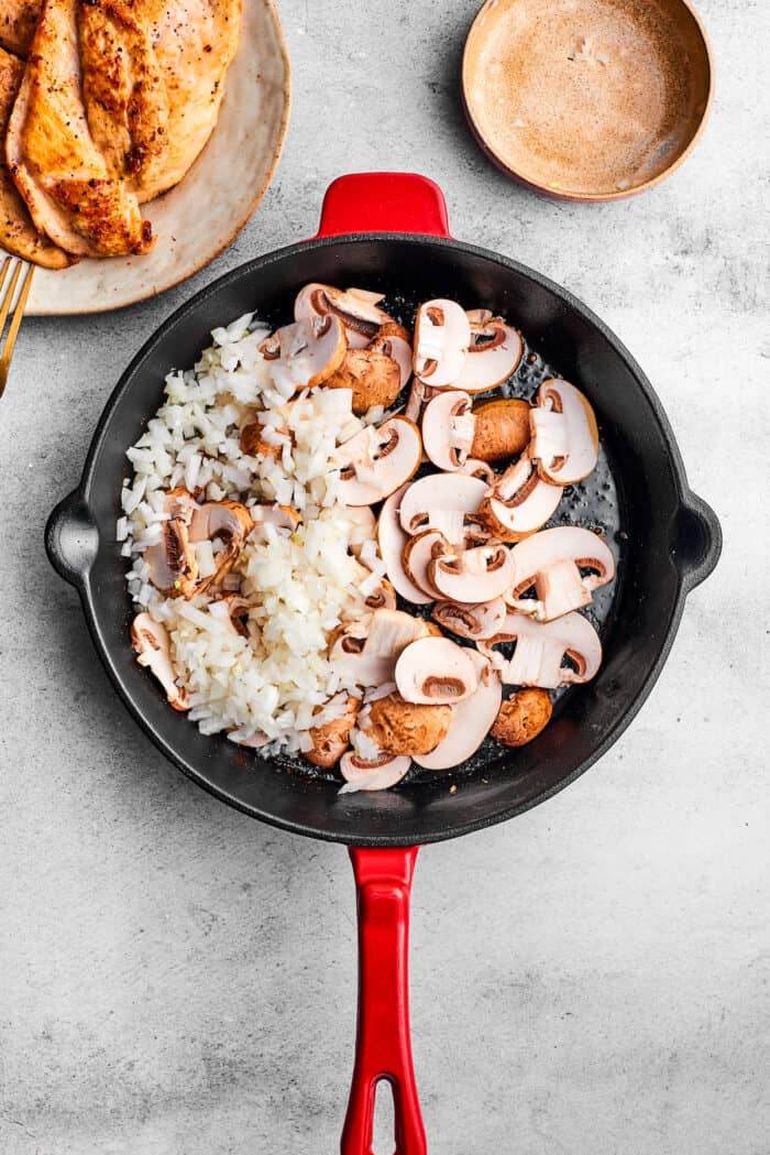 Shallots and sliced mushrooms in a skillet.