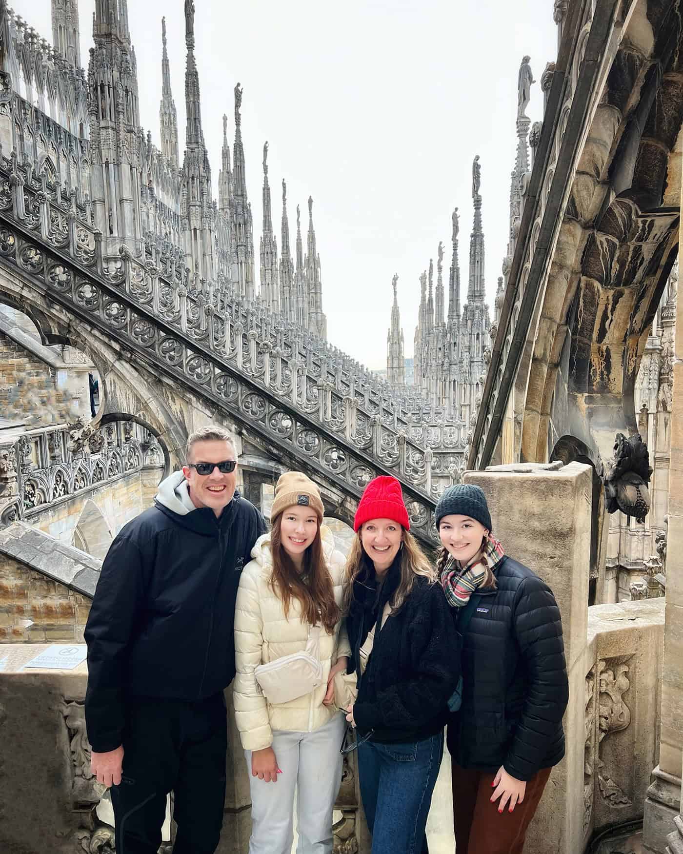 family photo taken on the rooftop of the duomo in Milan, Italy
