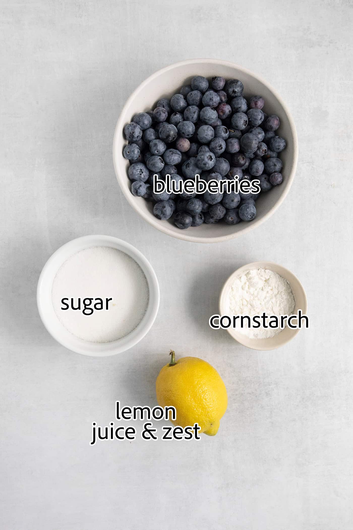 The ingredients for the blueberry layer is shown labelled: blueberries, lemon, sugar, cornstarch.