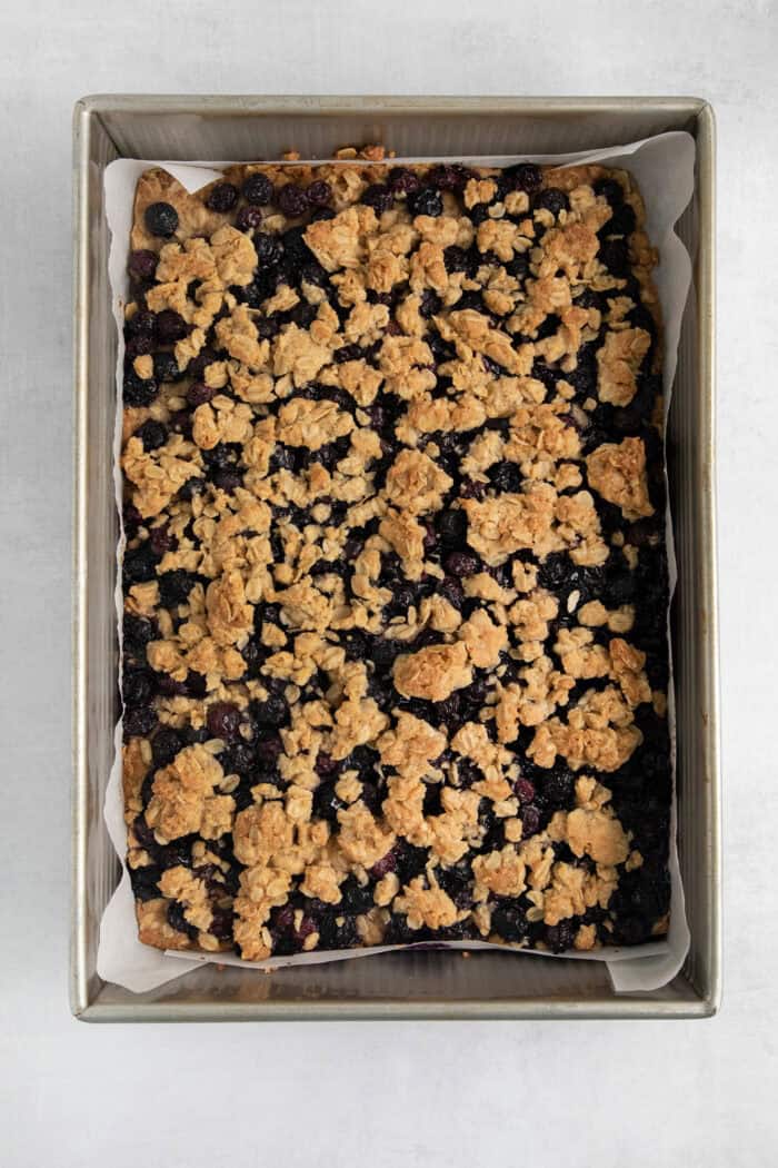 The baked blueberry crumble bars in the baking pan.