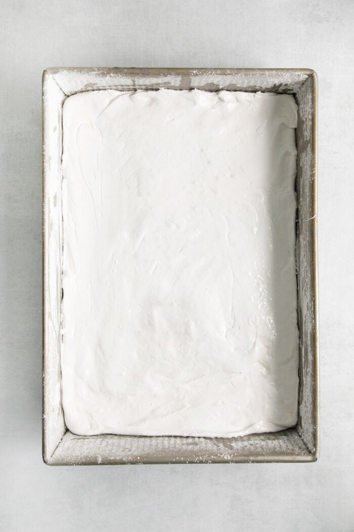 The marshmallow batter spread out in a pan.