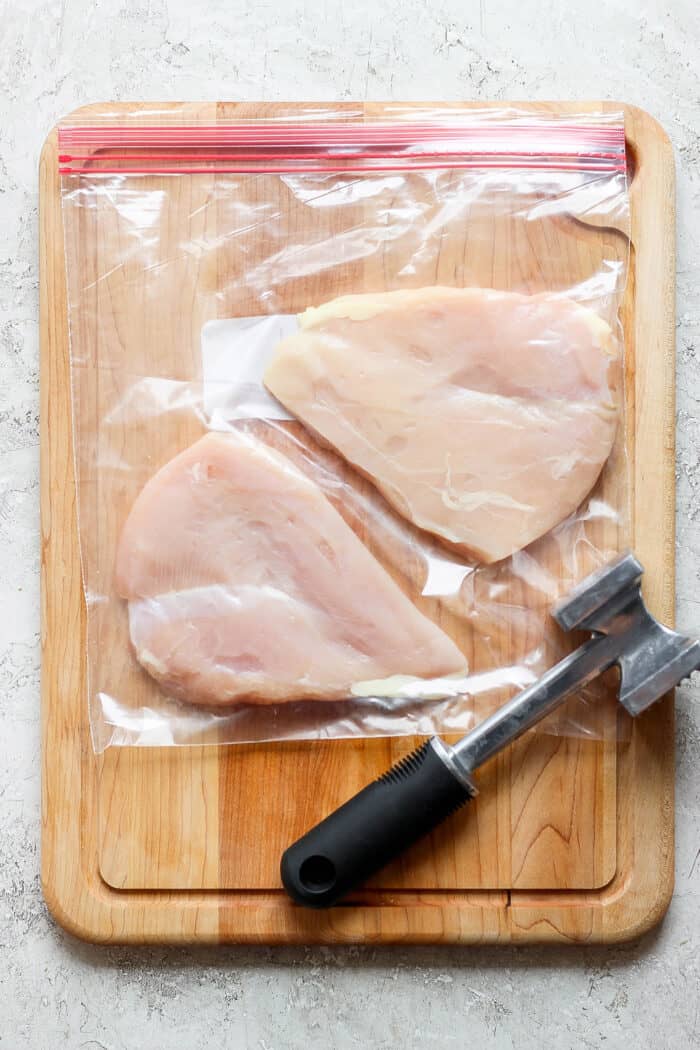 Chicken breasts are pounded until tender.